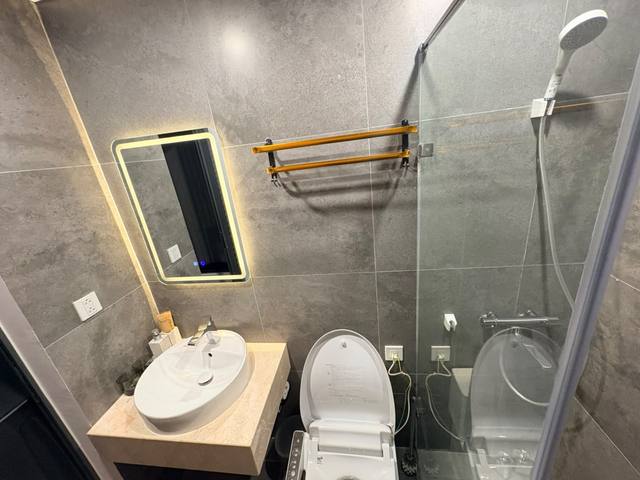 The private bathroom with a glass shower
