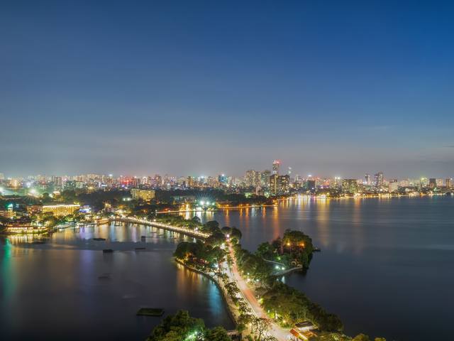West Lake and the city lights at dusk